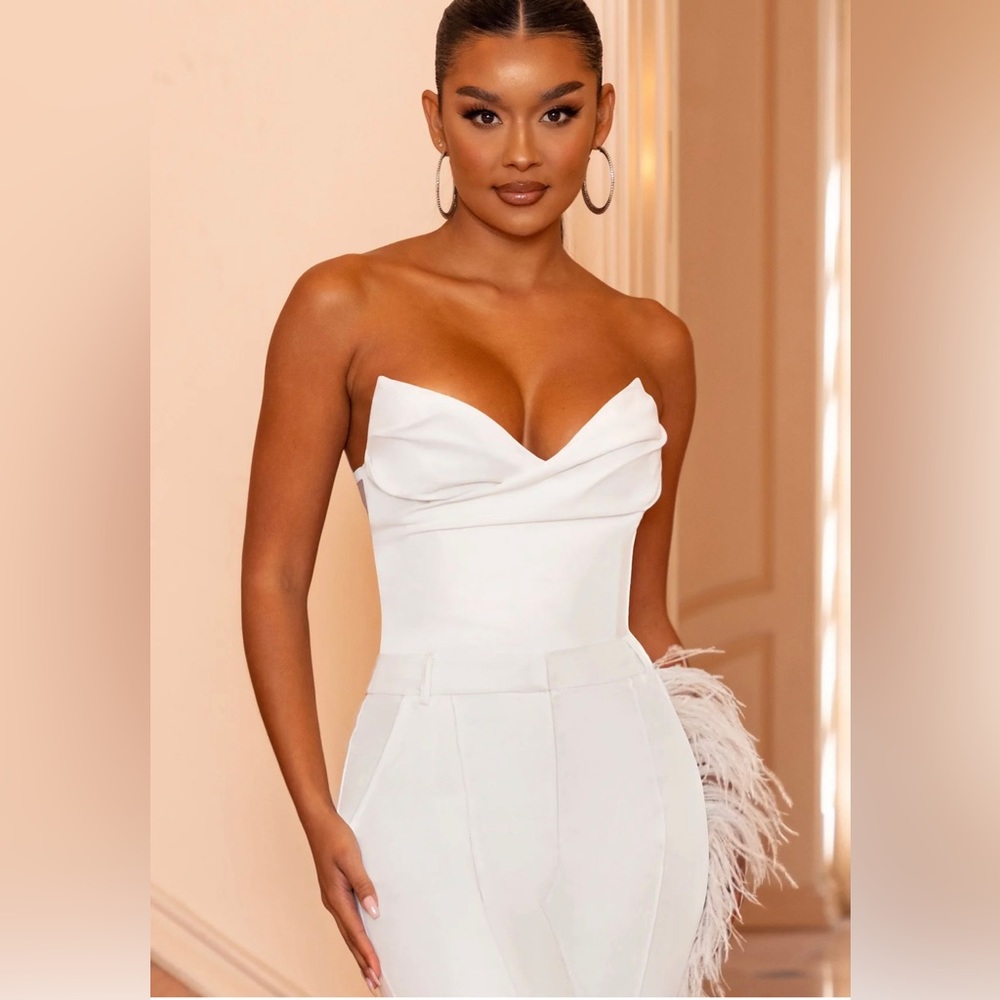 White corset and feathered trousers